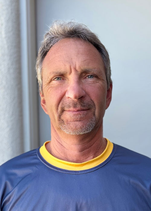 Co-founder and lead craftsman Chris Gierszewski, showcasing commitment to quality garage transformations.