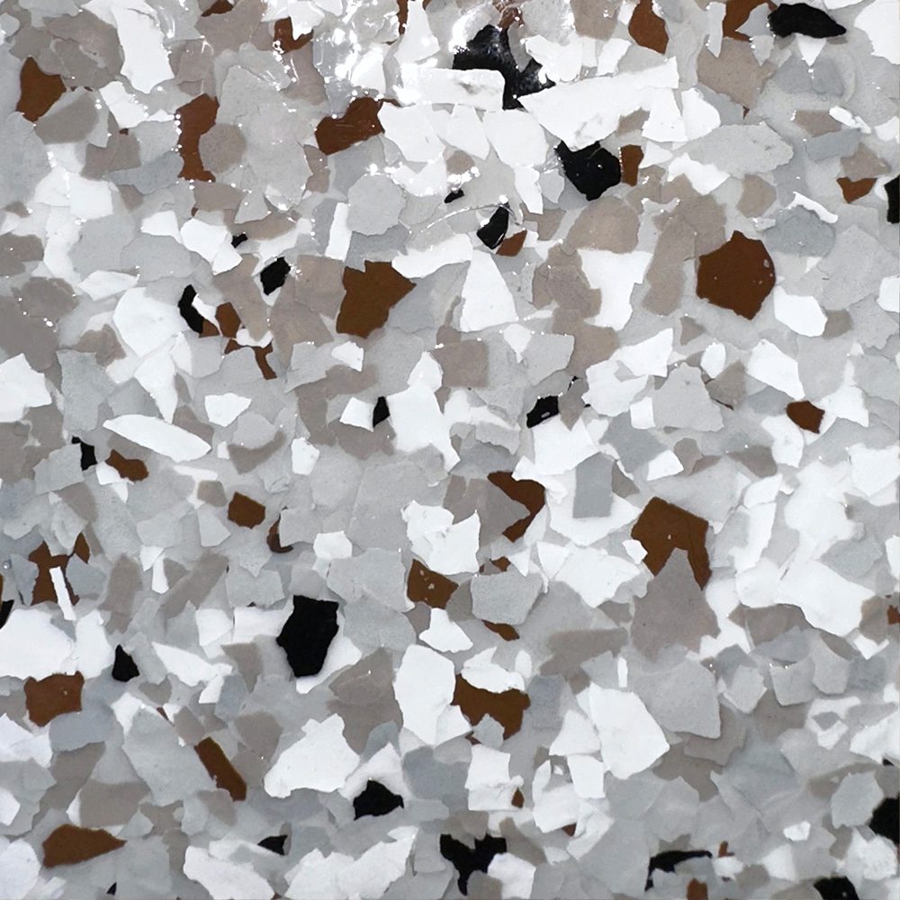 California Gray garage floor finish featuring a blend of gray, white, and brown flakes, showcasing a durable and stylish option from Gear Up Garage's Standard Series.