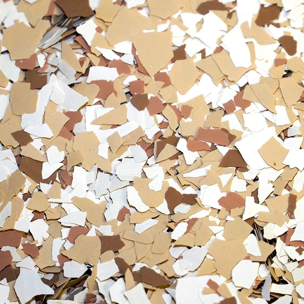 Medium Tan color flakes for garage flooring, showcasing a blend of light tan, beige, and white tones, reflecting options from Gear Up Garage's color chart.